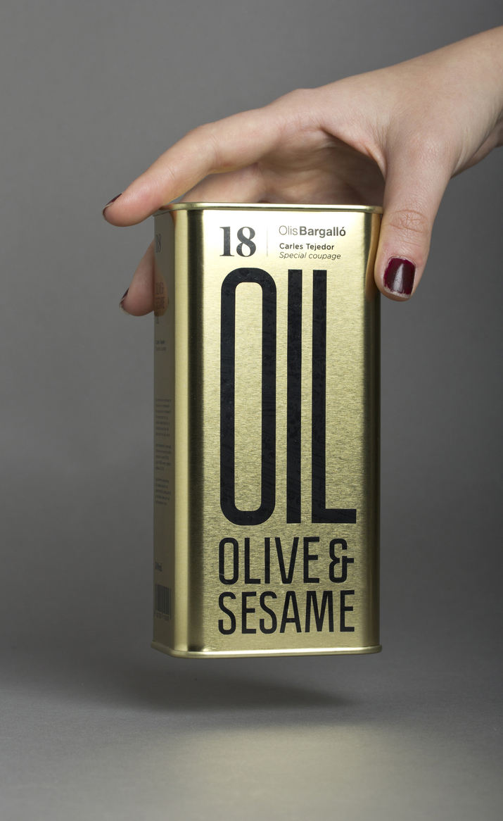 Packaging with condensed sans-serif typography and gold tin for Olive & Sesame Oil designed by Lo Siento