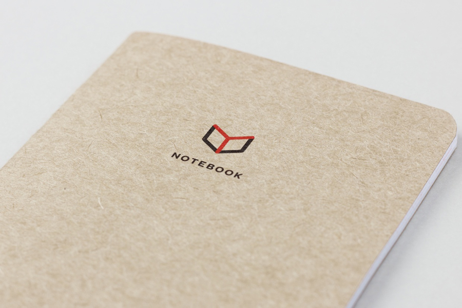 Notebook with icon and logo detail for The Chain Reaction Project designed by Bravo Company