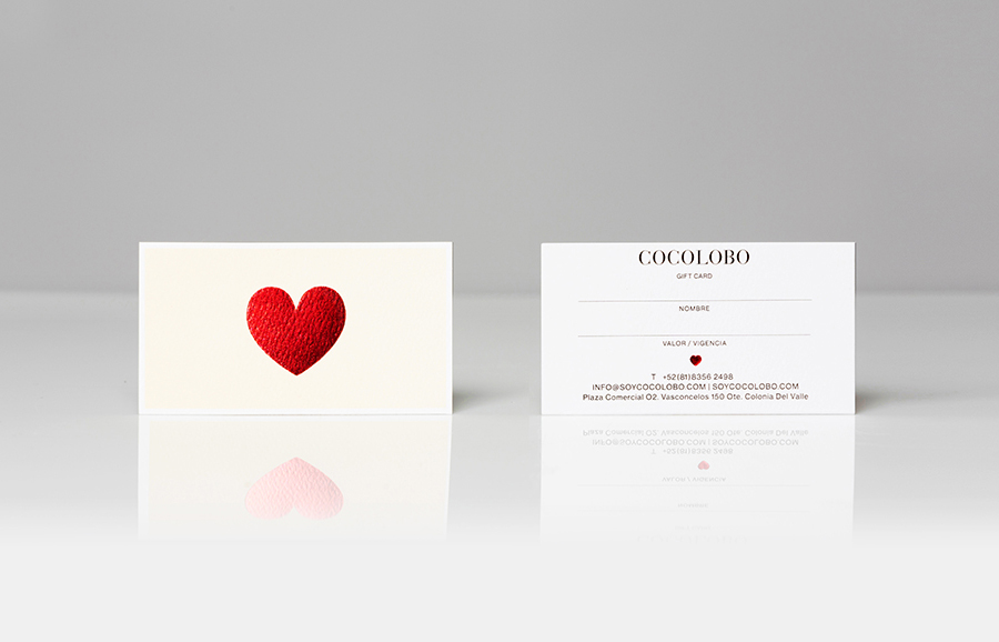Logo and gift cards with red foil print finish designed by Anagrama for high-end shopping boutique Cocolobo
