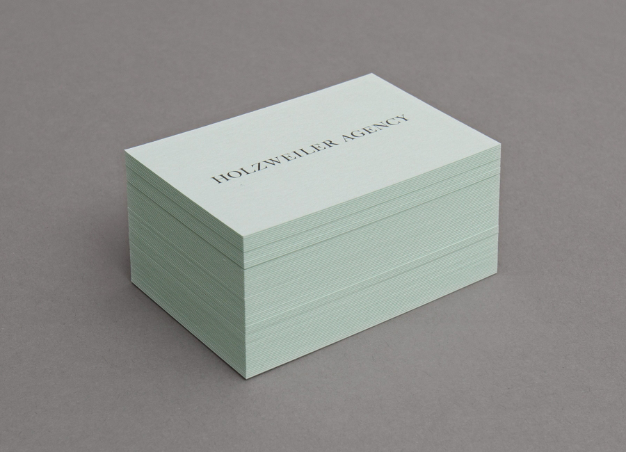 Logo and coloured board business card designed by Bielke+Yang for contemporary fashion distributor Holzweiler