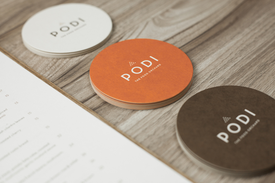 Logotype and coasters designed by Bravo Company for Singapore-based organic restaurant Podi