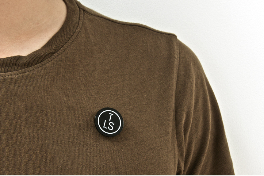 Logo as a pin badge created by Studio Makgill for designer furniture and accessories retailer The Lollipop Shoppe