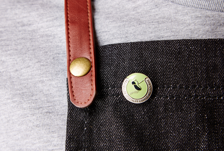 Logo as a pin badge for Melbourne espresso bar Traveller designed by The Company You Keep