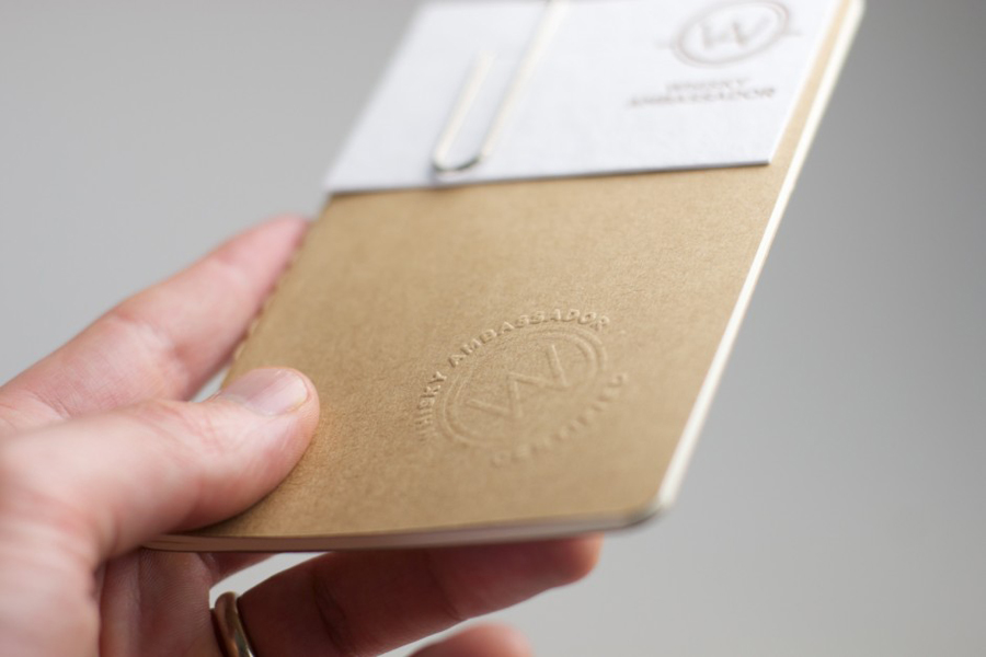 Logo, blind embossed note book and business card with copper print detail designed by O Street for Whisky Ambassador