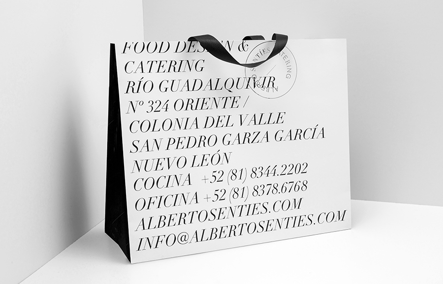 Bag with silver foil detail for Alberto Senties Catering designed by Anagrama