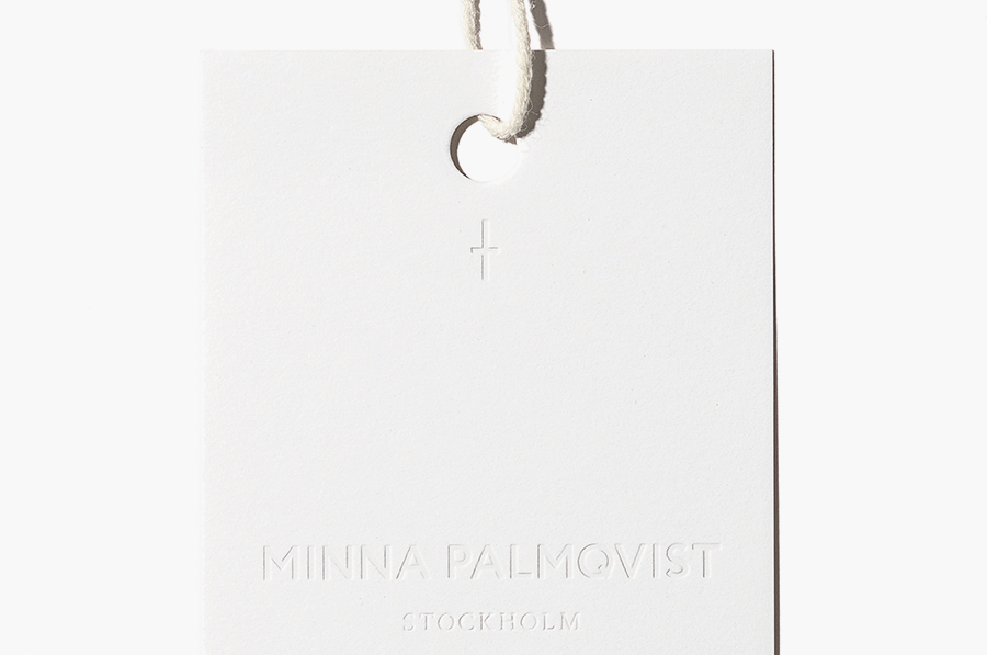 Logotype, mark and blind debossed tag designed by Bedow for fashion designer and label Minna Palmqvist
