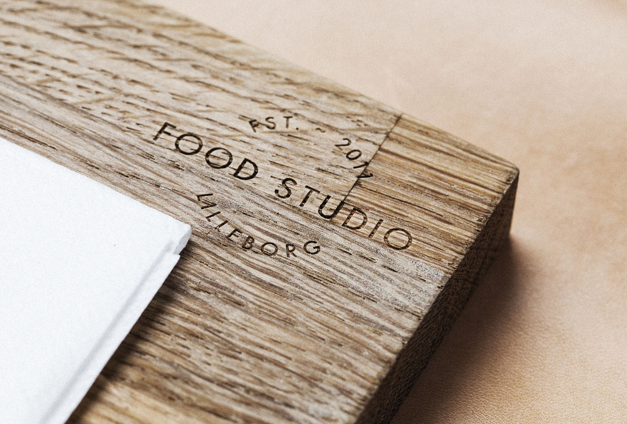 Logo design debossed into a wooden surface by Bielke+Yang for Food Studio