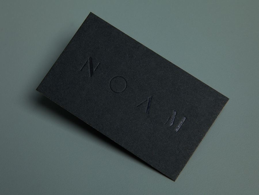 Logo and business card with black deboss foil detail created by Graphical House for interior design consultancy Noam