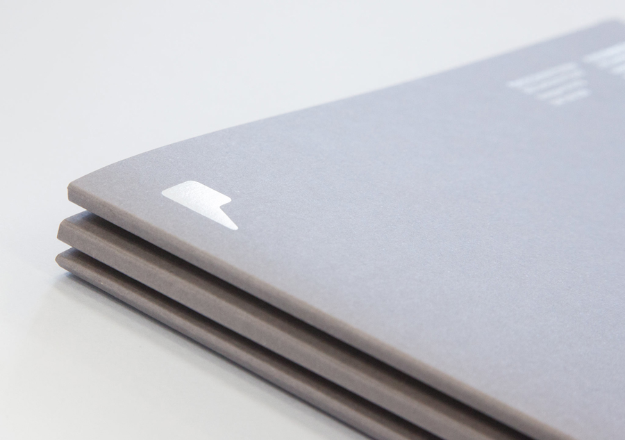 Logo and folders with grey board and white ink detail designed by Freytag Anderson for Partick Dental featured on BPO