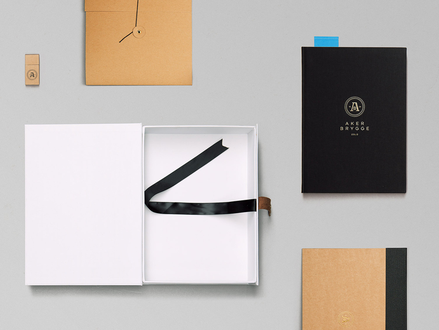 Logo, stationery and accessory design with gold foil detail designed by Bleed for the redevelopment of Oslo waterside district Aker Brygge