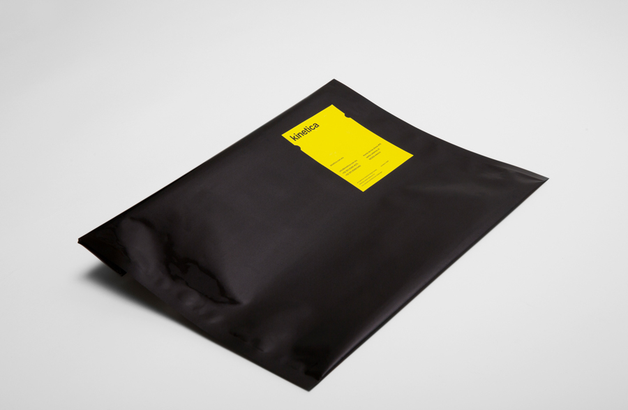 Logotype and envelope with die cut yellow sticker designed by Face for industrial design studio Kinetica