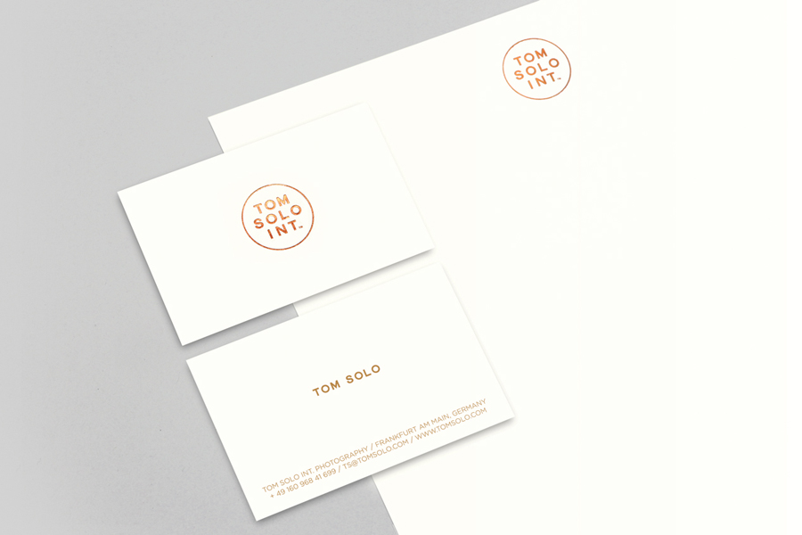 Logo, business card and letterhead with copper foil detail for photographer Tom Solo designed by Mash