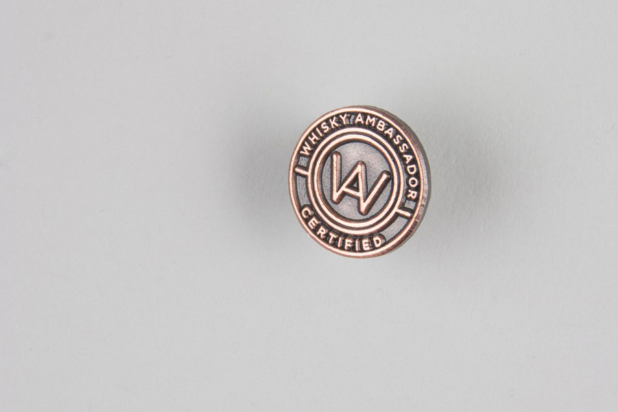 Bronze logo pin designed by O Street for Whisky Ambassador