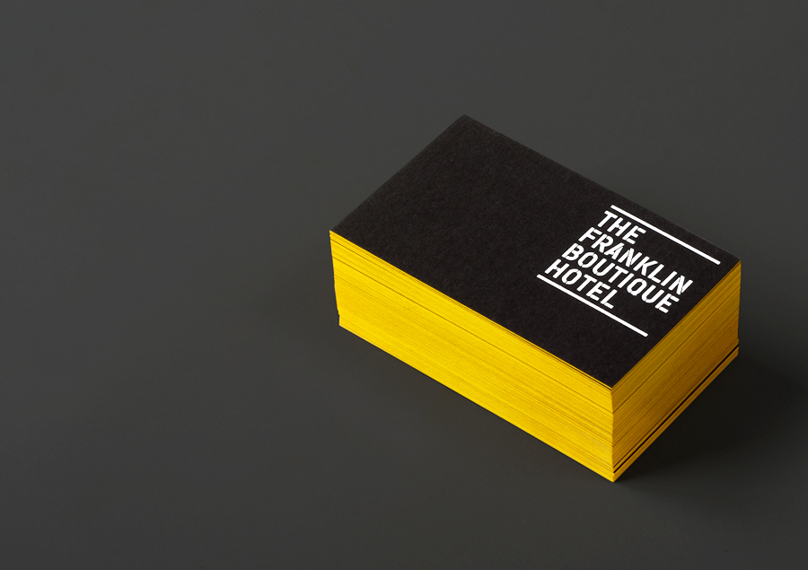 Logo and business cards with yellow edge painted detail and white foil designed by Band for The Franklin Boutique Hotel