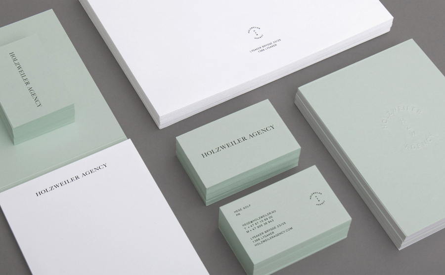 Logo and stationery with blind emboss and coloured board detail designed by Bielke+Yang for contemporary fashion distributor Holzweiler