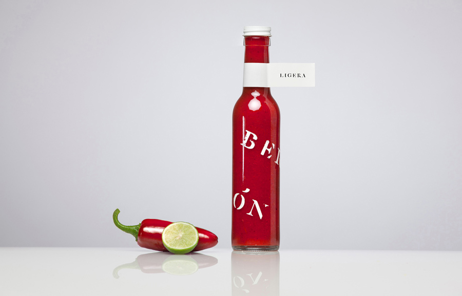 Bottle with screen print and sticker detail for confectionery shop Bermellón designed by Anagrama