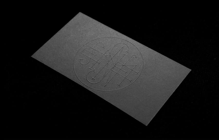 Logo and business card with a black board and blind embossed detail designed by Anagrama for Latin American horror film production company Nemesis Films