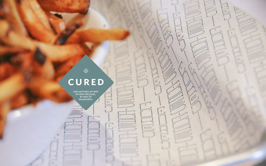 Brand identity and print designed by Föda for San Antonio restaurant Cured