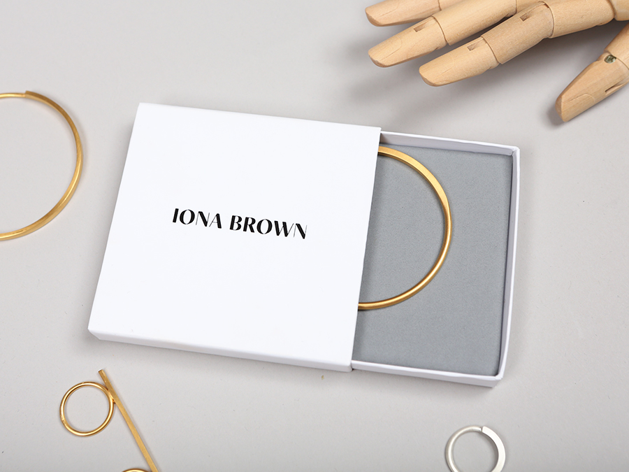 Packaging with black block foil and Colorplan paper for contemporary jewellery designer Iona Brown designed by Sam Flaherty