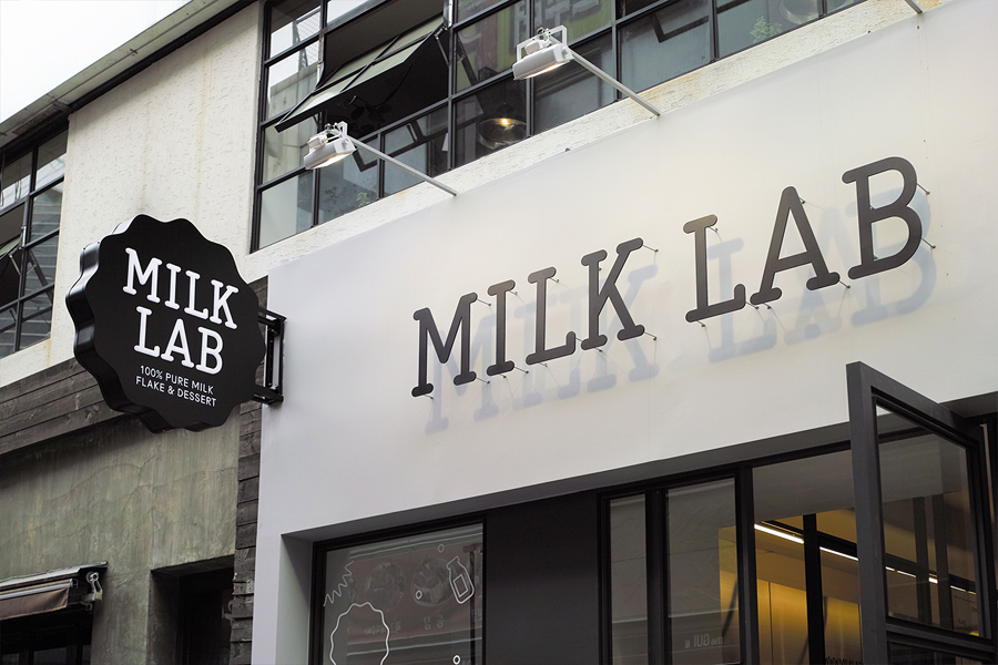 Exterior signage designed by Studio FNT for South Korean dessert restaurant Milk Lab