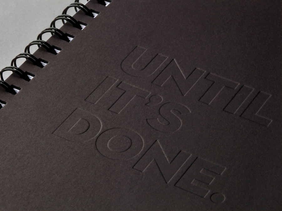 Debossed notepad designed by Bond for Finnish information system development and optimisation company Attido