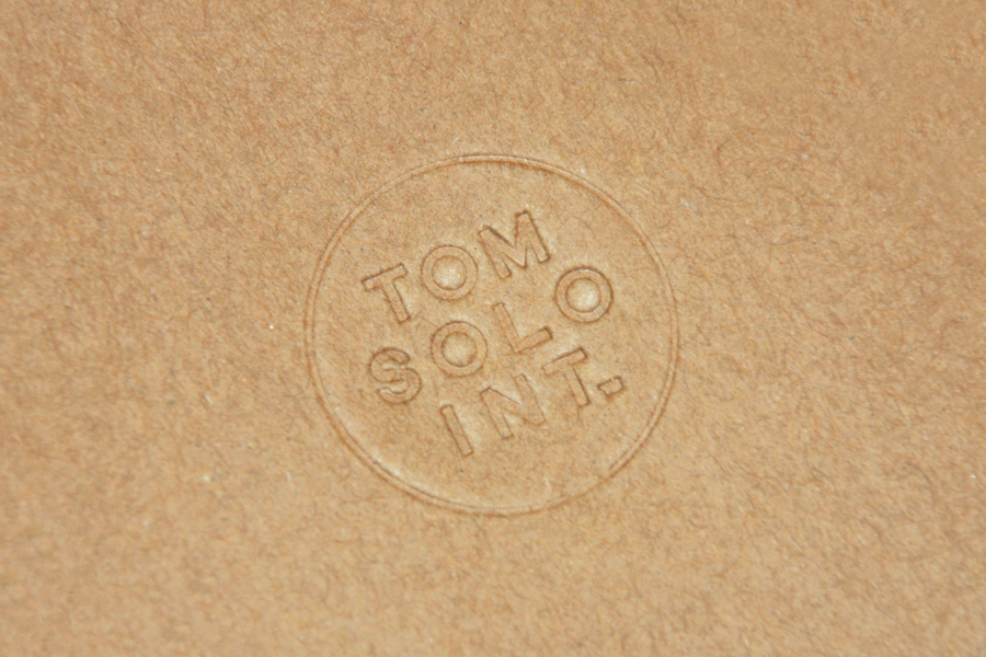 Blind debossed logo for photographer Tom Solo designed by Mash