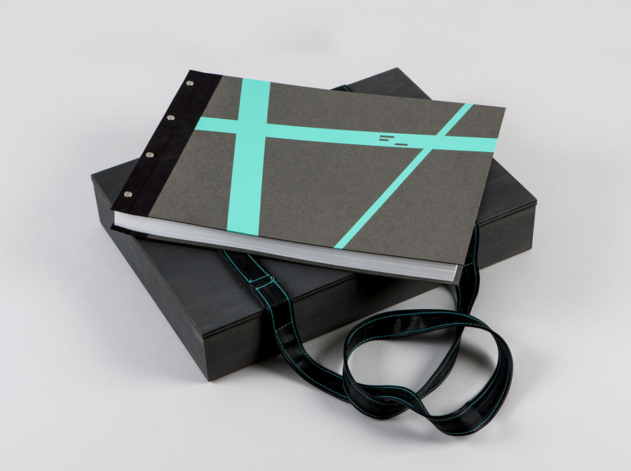 Notebook with fluorescent sticker detail and bike inner tube strap designed by LSDK for Frederik Laux Photography