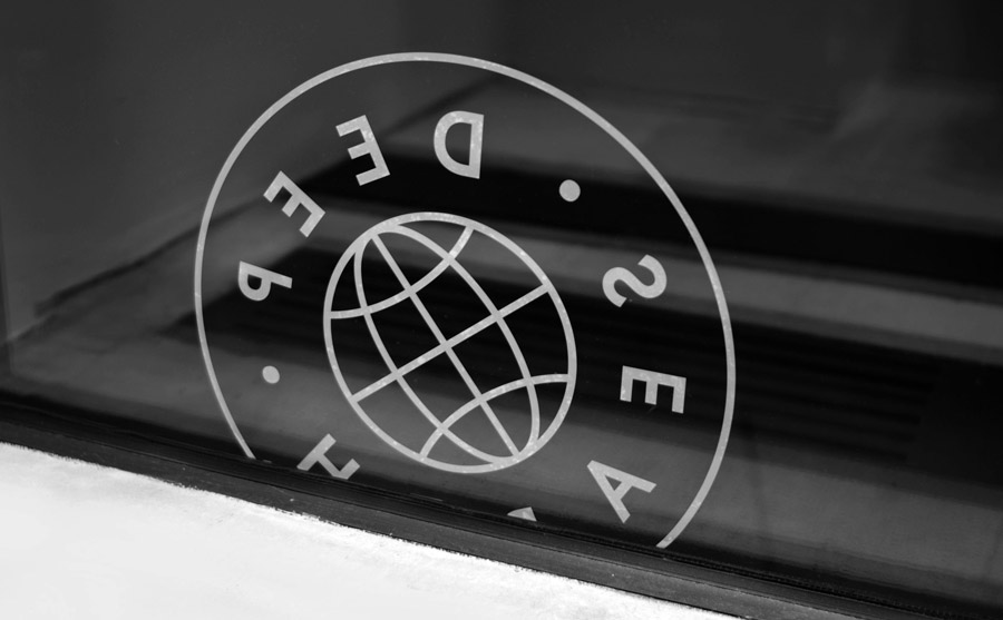 Logo as a window decal created by Bielke+Yang for Norwegian shoe brand Deep Search