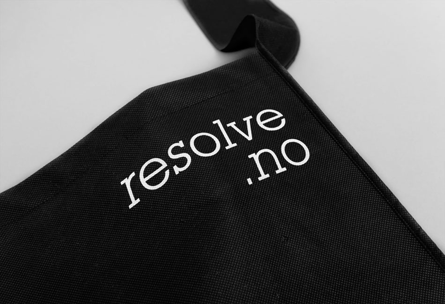 White ink print detail across a black bag created by Neue for cleaning and restoration service provider Resolve