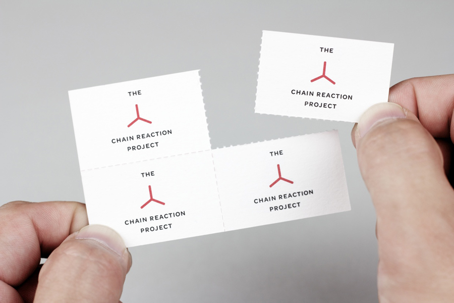 Logo and business card with perforated detail for The Chain Reaction Project designed by Bravo Company