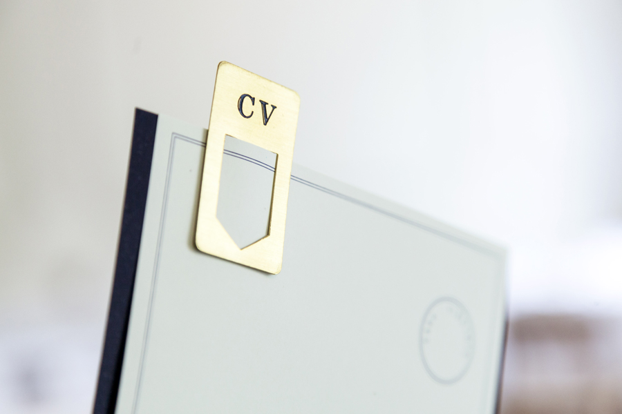 Menu with navy blue and green pastel paper and brass clip detail designed by Savvy for restaurant Casa Virginia