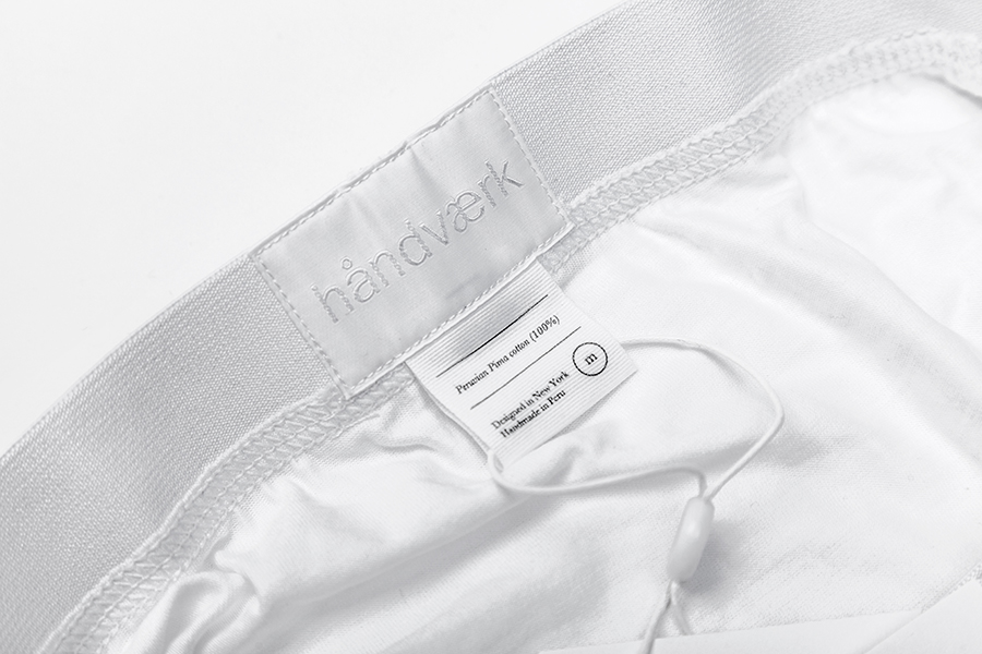 Logotype as a sticked label detail designed by Savvy for fashion brand Handvaerk