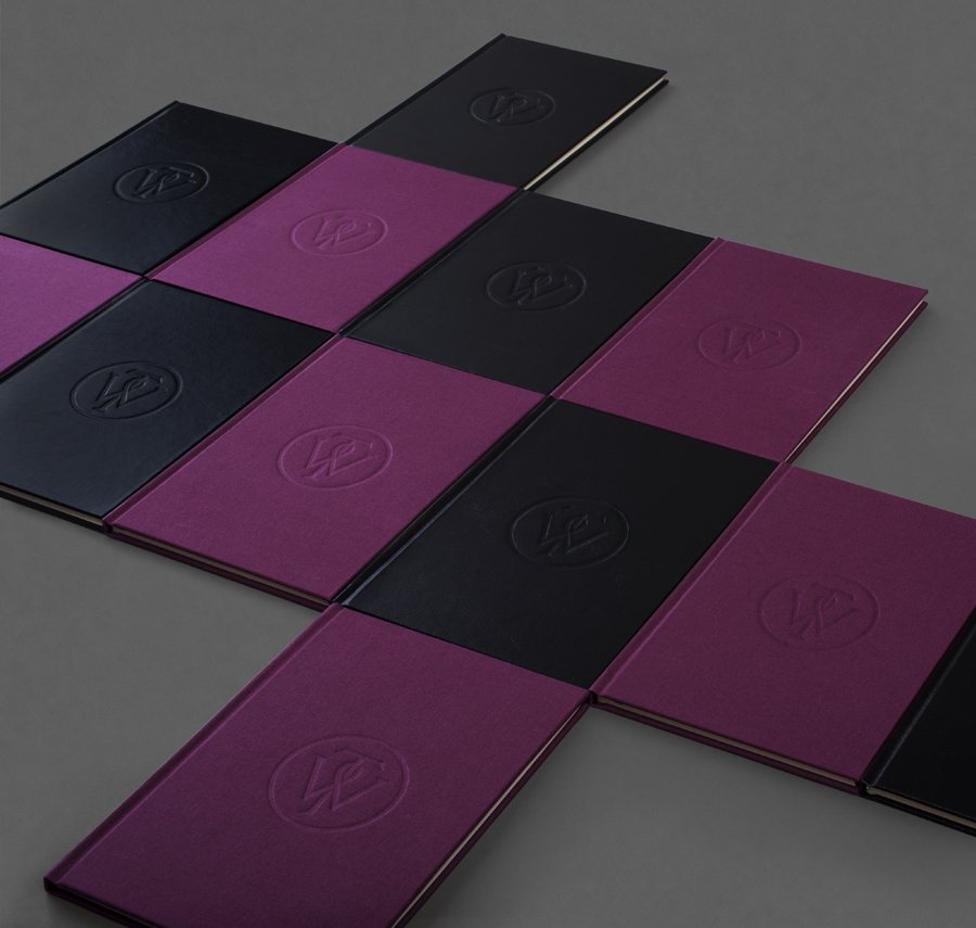 Notepad with purple textile and black leather covers designed by Bunch for business consultancy Willow Tree 