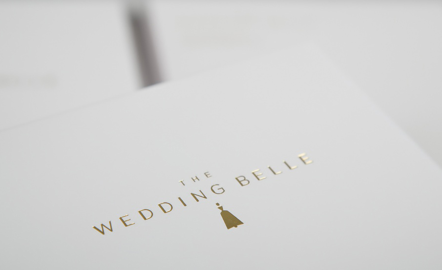 Logo and print with gold foil detail designed by Ghost for wedding planner The Wedding Belle