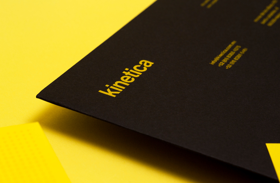 Logotype and folder with yellow ink detail designed by Face for industrial design studio Kinetica