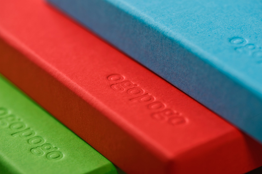 Packaging with blind deboss detail across coloured board for Croatian boxed experience Ogopogo designed by Bunch