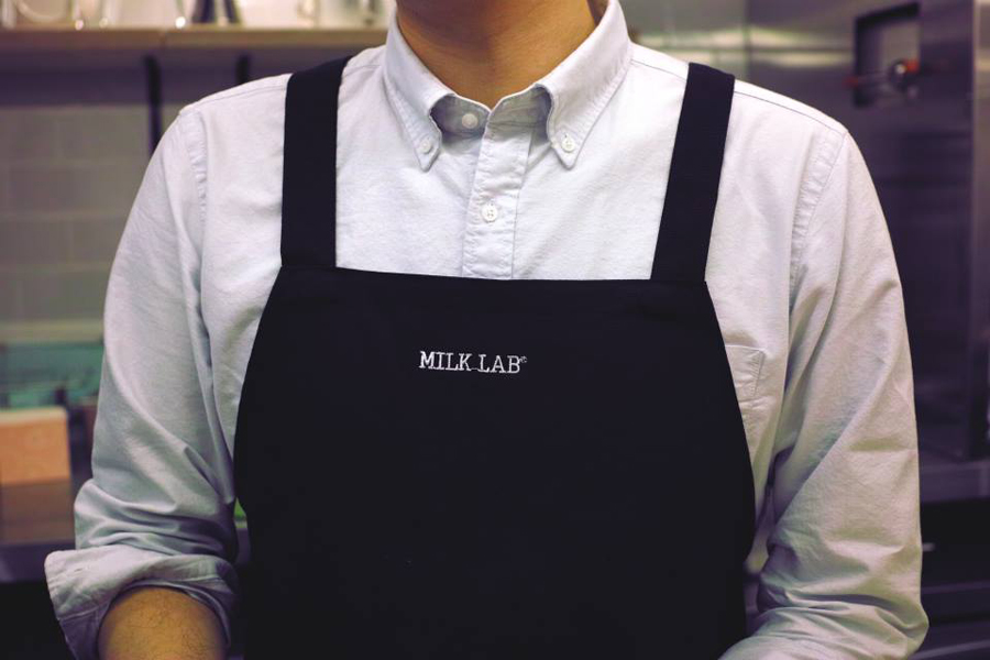 Milk Lab pinny with stitched logo detail designed by Studio FNT