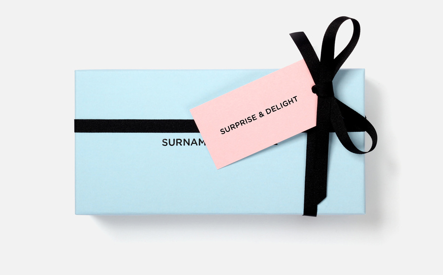 Logo, box and tag designed by NB Studio for consumer focused brand communications agency Surname & Surname