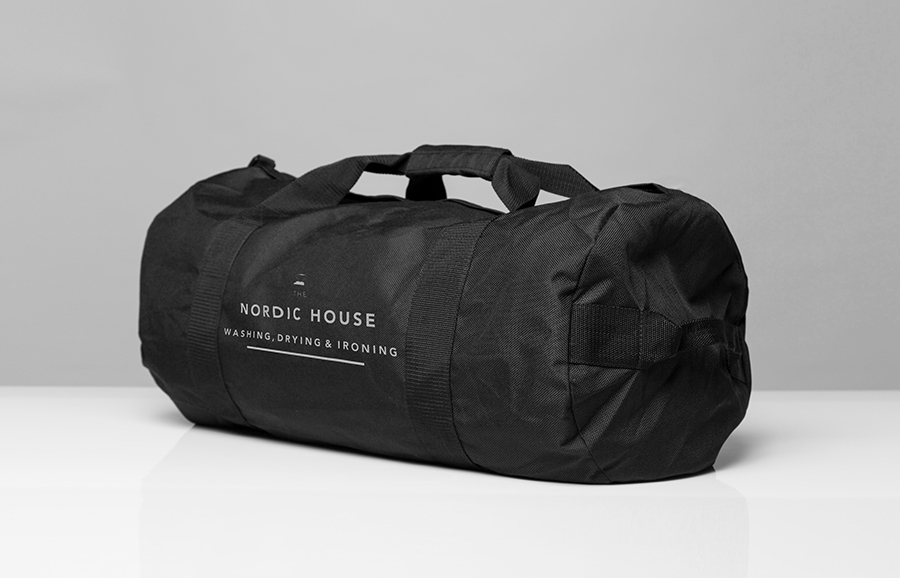 Logo and bag designed by Anagrama for dry cleaning shop Nordic House