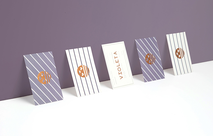 Logotype and business cards with copper foil detail designed by Anagrama for traditional Argentinian bakery Violeta