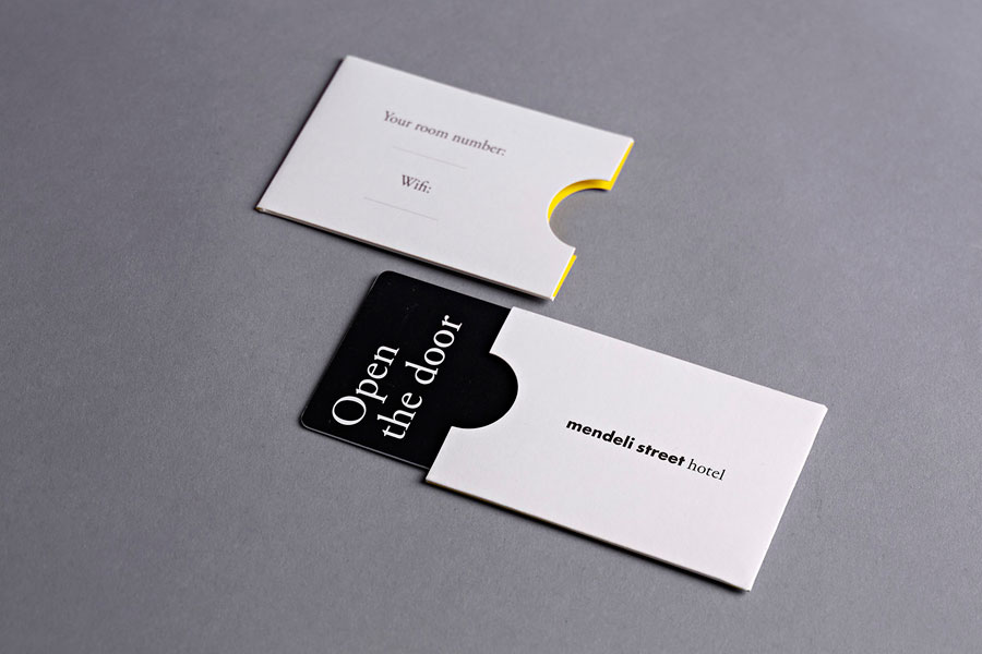 Key cards and sleeves with yellow interior walls created for Tel aviv hotel Mendeli Street designed by Koniak