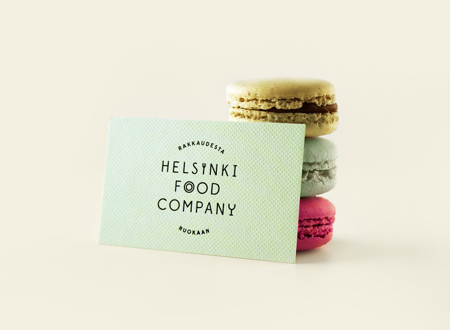 Logo and business card with an embossed surface detail for Helsinki Food Company designed by Werklig