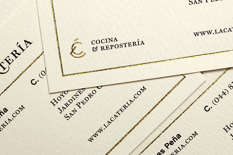 Monogram and business card with gold foil print finish designed by Firmalt for San Pedro catering business La Catería