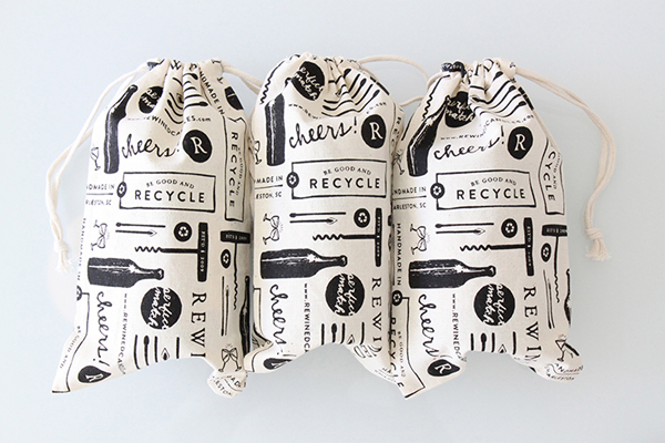 Packaging with illustrative detail including cloth bags designed by Stitch for craft candle brand Rewined 