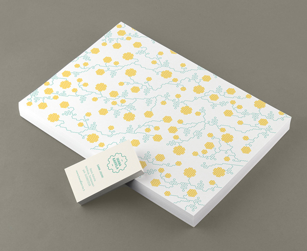 Logo and stationery with geometric floral illustrative detail designed by Werklig for freight container coffee shop Ihana Kahvila