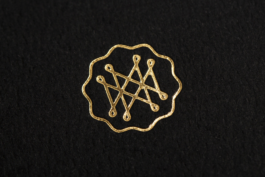 Logo as a gold foil detail for on-line art, design, architecture and photography journal Mal de Mar designed by Face