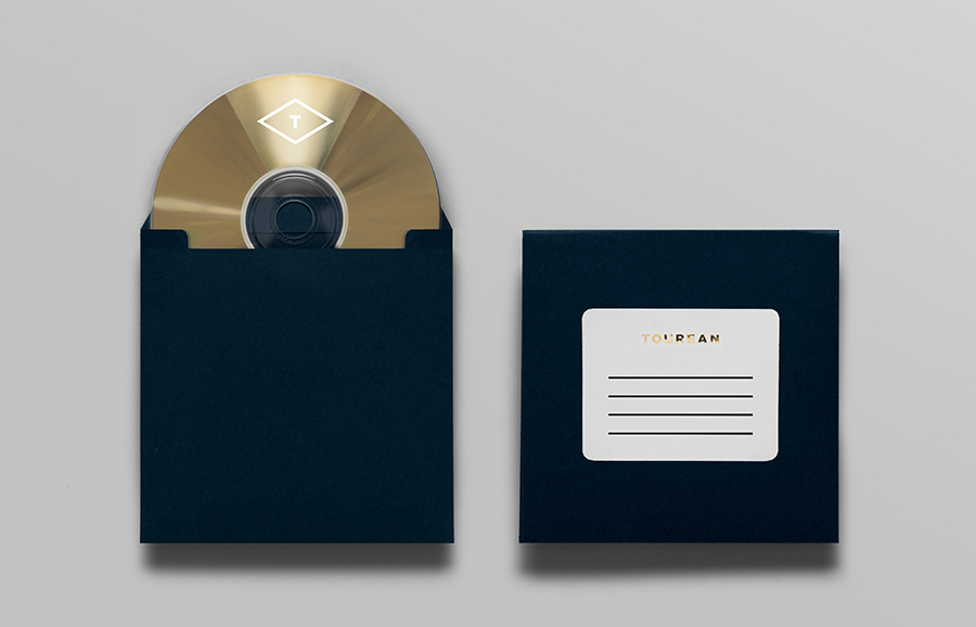 Logo and CD case with gold foil detail designed for British multinational venture capital firm Tourean by Anagrama 