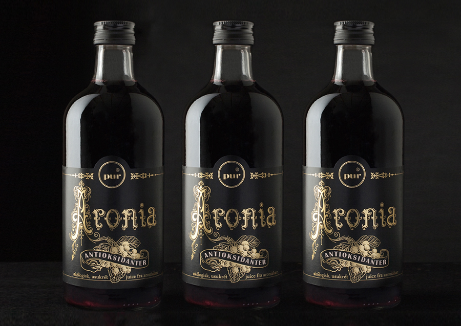 Packaging with gold foil and etched illustrative detail designed by Work In Progress for organic cordial Aronia