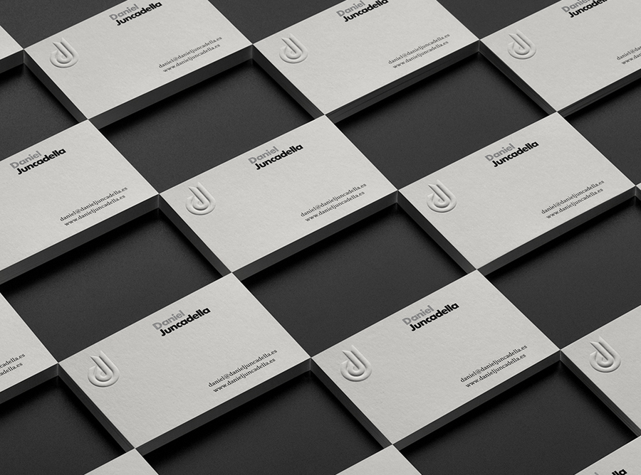 Logo and blind embossed business card with silver spot colour detail for Daniel Juncadella designed by Mucho