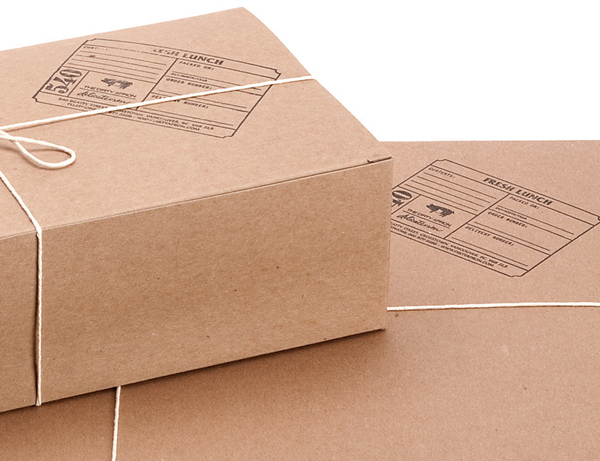 String tied uncoated unbleached boxes with stamp detail created by Glasfurd & Walker for delicatessen The Dirty Apron